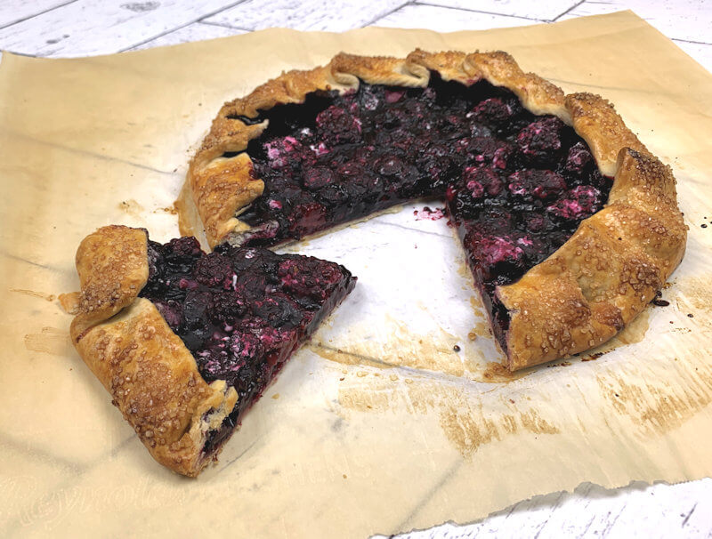 Black and Blueberry Galette with wedge cut out.