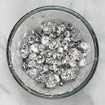 Step 2 - Transfer the berries to a bowl and toss them with the granulated sugar and corn starch.