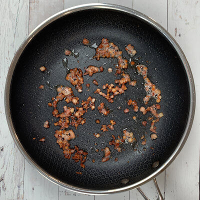 Step 2 - Cut the pancetta in small pieces and cook the pancetta in a skillet (not oil or butter needed) until crisp.