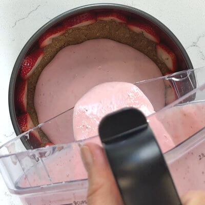 Step 4 - Pour strawberry-yogurt mixture into the spring form. Use a spoon to create a smooth top. Cover with plastic wrap and place in a refrigerator to set. Leave in refrigerator for 6 hours or overnight.