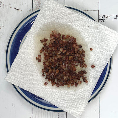 Step 2 - Chop the pancetta in small cubes and cook on a low heat until all the fat is rendered. Drain on a kitchen towel.