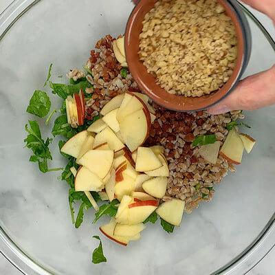 Step 4 - Add farro, pancetta, sliced apple and chopped walnuts and mix.