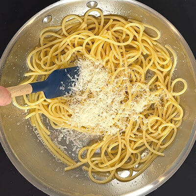 Step 4 - Add most of grated Parmigiano Reggiano cheese and mix again. Allow the cheese to melt.
