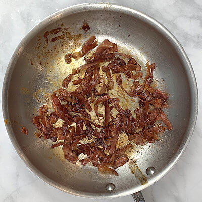Step 1 - Cook the pasta according to the directions on the packaging.Melt butter in a skillet and add the Prosciutto. You can cut the Prosciutto in strips and then cook it or cook the entire slice and cut them afterwards. Cook the ham until crispy and then drain on paper towel.