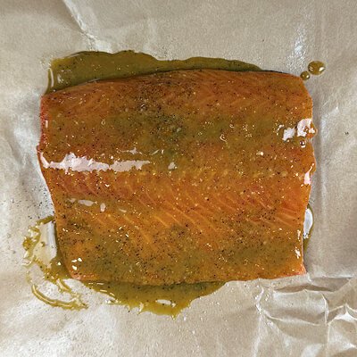 Step 2 - Salt & pepper the salmon and apply the glaze and allow it to marinate the fish for at least 30 minutes in the fridge.