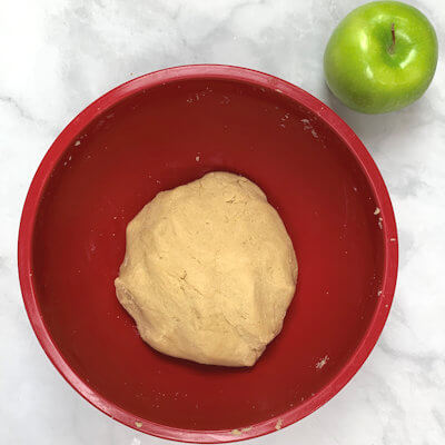 Step 1 - Make the dough by mixing flour, brown sugar, salt and cold butter. Use 2 knives or a pastry cutter to cut the butter into pea size pieces. Add half of a whisked egg and form a uniform dough by mixing and kneading with your hands.