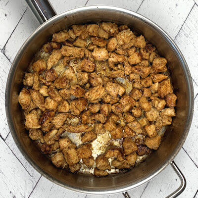 Step 3 - Mix the spices and rub it into the cubes chicken. Cook the chicken in the garlic butter until done. This will take about 5 minutes.