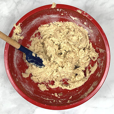 Step 2 - Gradually add the flour mixture to the butter mixture on low speed.