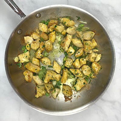 Step 3 - Add celery leaves, spring onions and cook another 2-3 minutes.Add 1 tablespoon of water and toss everything.