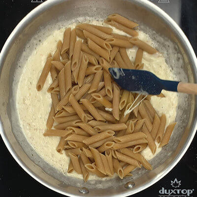 Step 4 - Add the cooked pasta to the sauce and stir. If the sauce is too thick, add some of the pasta water.