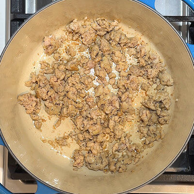 Step 1 - Heat oil in a pan, remove the casing from the chicken sausage and add the sausages to the hot oil. Use a spoon or spatula to break the sausage meat apart, until it is all done and in small pieces.