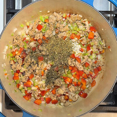 Step 3 - Add oregano, thyme, salt and pepper and stir.