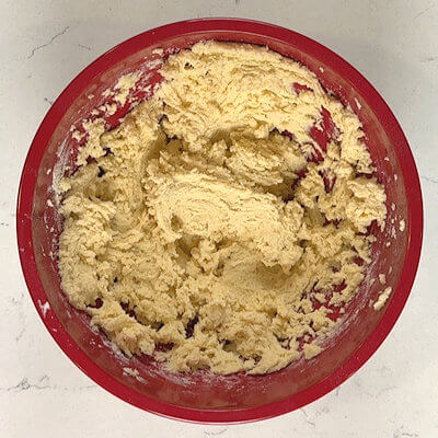 Step 3 - Finally add the flour and mix until you have a thick smooth dough.