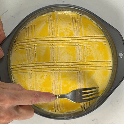 Step 6 - Use a fork to carve or score the top of the cake. This pattern is the 'traditional' way, but you can create something special or not score at all.