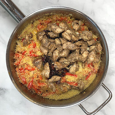 Step 4  - Add couscous, juice mixture and the chicken and stir. Bring to a boil, turn off heat immediately and cover. Allow the couscous to absorb the liquids.
