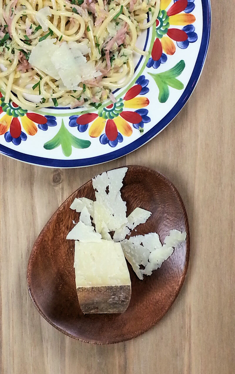 Close-up of plate with Pici pasta with cabbage & ham