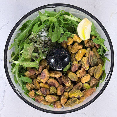Step 1 - Place all ingredient in a food processor or blender and pulse/blend until the pesto reaches your desired texture.