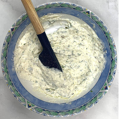 Step 1 - Make the Parmesan and Herb spread by mixing sour cream, mayonnaise, Parmigiano Reggiano cheese, fresh herbs, butter and lemon juice.