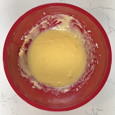 Step 2 - Add the egg and the vanilla extract and mix.