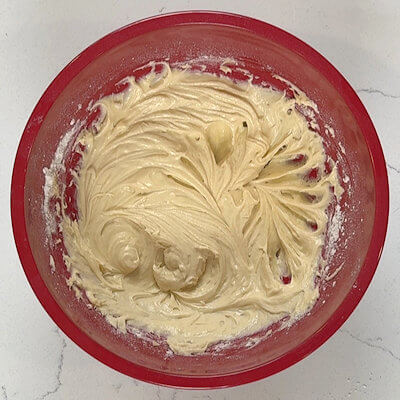 Step 3 - Mix salt with self-rising flour. Add the flour and the sour cream alternately to the batter and mix just until combined after each addition.