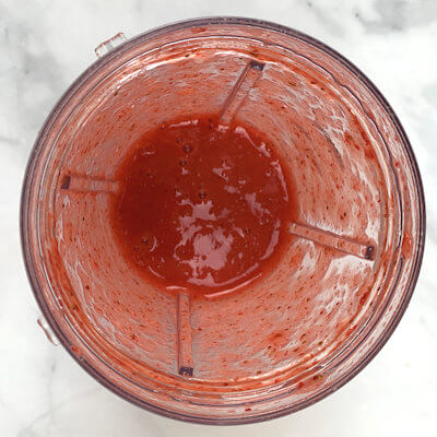 Step 1 - Hull and wash the strawberries and cut them in quarters. Place fruit in a food processor and process into puree.