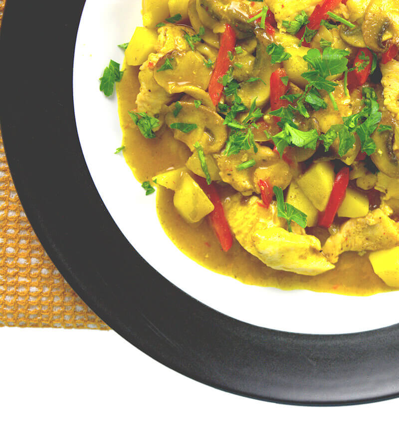 Close up image of Chicken with potatoes in coconut sauce