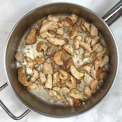 Step 1 - Heat butter in a skillet, add the chicken and saute until just done.