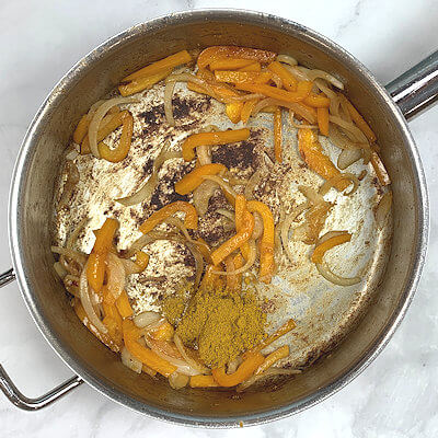 Step 3 - Add curry powder and saute for half a minute.
