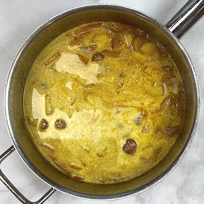 Step 6 - Add coconut milk to the potato mix and cook 