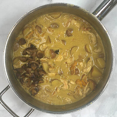 Step 7 - Add mushrooms and chicken and fold into sauce and warm if needed