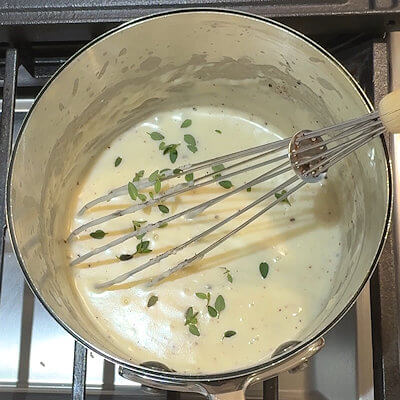 Step 4 - Add salt, pepper, nutmeg and fresh or dried thyme and stir.