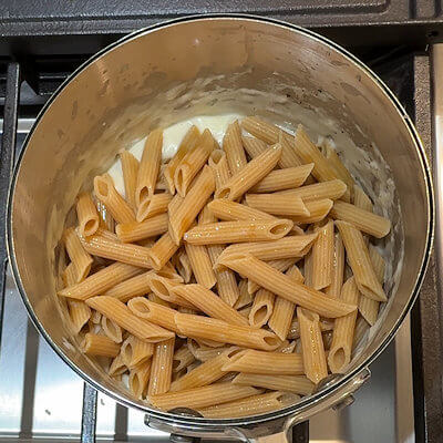Step 5 - Add pasta and mix.