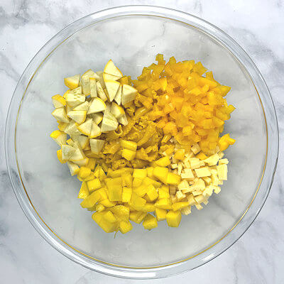 Step 4 - In a bowl, add all salad ingredients (pasta, summer squash, yellow bell pepper, mango, and cheese).