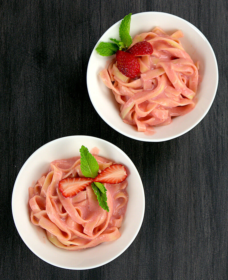 Two bowls of Sweet strawberry pasta dessert