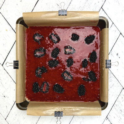Step 5 - Pour simple strawberry jam on top of the base and divide evenly. place blackberry halves on to top.