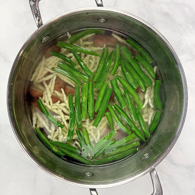 Step 1 - Cook the potatoes, pasta and green beans in boiling water. Start with the potatoes and trofie and after 4-5 minutes add the green beans. There will still be some bite left in the green beans. Add them earlier if you want them softer. 