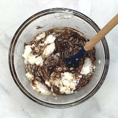 Step 4 - Add part of the egg white to the chocolate mixture and then add the chocolate mixture to the rest of the egg whites. Mix.
