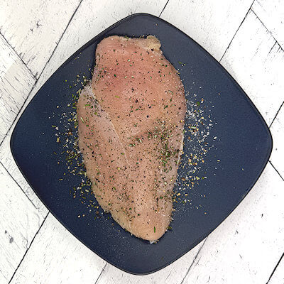 Step 2 - Rub the chicken with salt, pepper and rosemary.