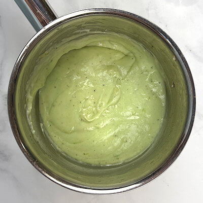Step 3 - Make the cheese sauce from butter, flour and warm milk and add the shredded Sage Derby cheese. Season with salt & pepper.