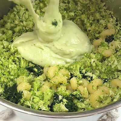 Step 4 - Mix pasta with vegetables and cheese sauce and season if necessary.