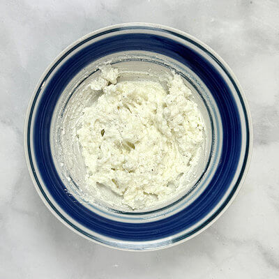Step 2 - While the pasta is cooking, make your sauce. Combine goat cheese, olive oil and salt and pepper and mix until smooth.