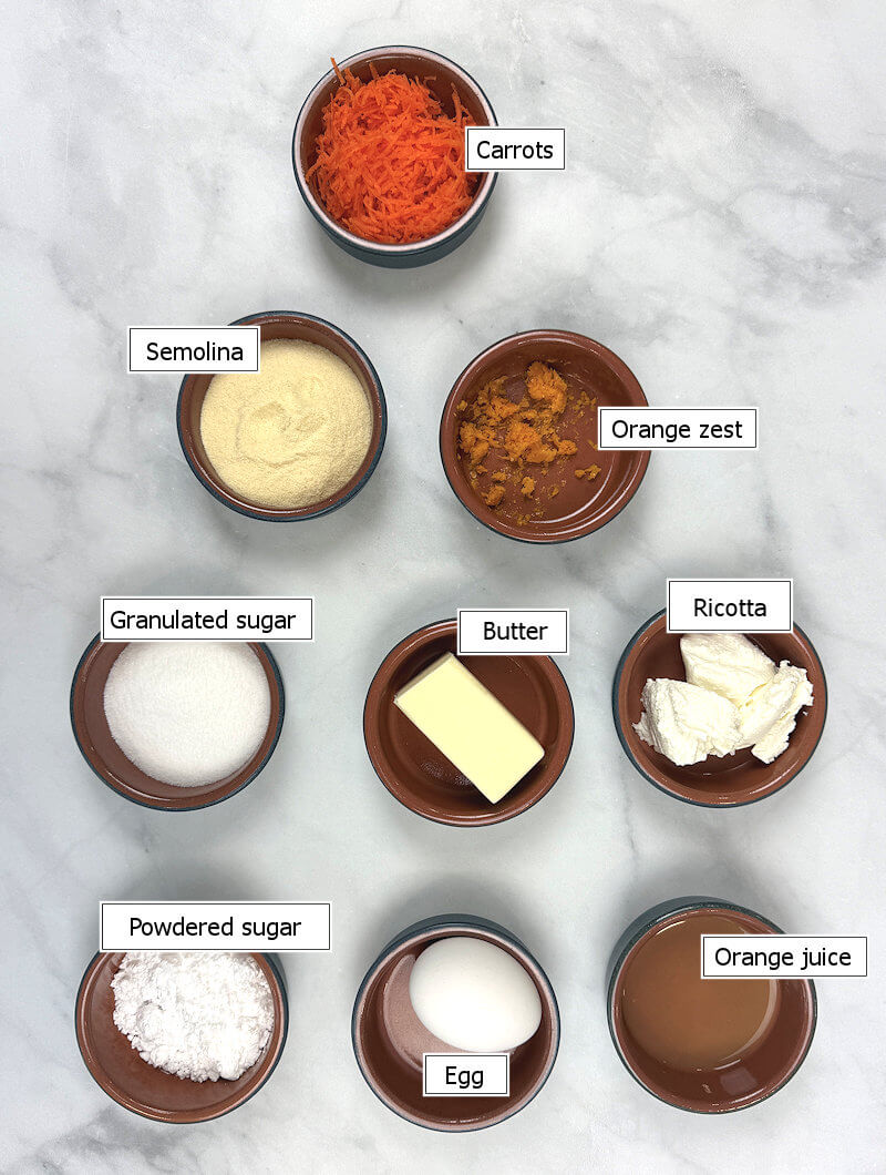 Key ingredients to make a semolina carrot cake with orange glaze
