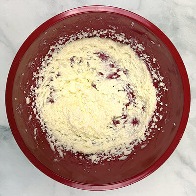 Step 3 - In a separate bowl, combine the butter and the remaining 90 grams granulated sugar. Beat on medium-high until light and fluffy, about 3 minutes, scraping the bowl once or twice.