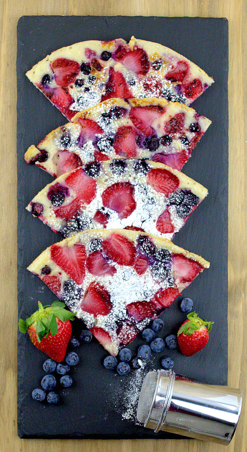 Yeast pancake with fruit, cut in quarters.