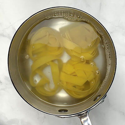 Step 3 - Cook the pasta in a separate pan according to the directions on the packaging.