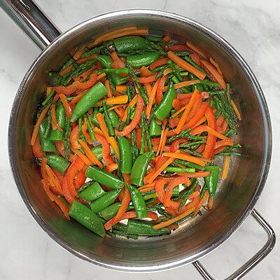 Step 2 - Heat oil in a skillet and add the minced ginger and garlic and saute for a few second until fragrant. Add bell pepper and sugar snaps and saute for 5 minutes. Remove from heat.
