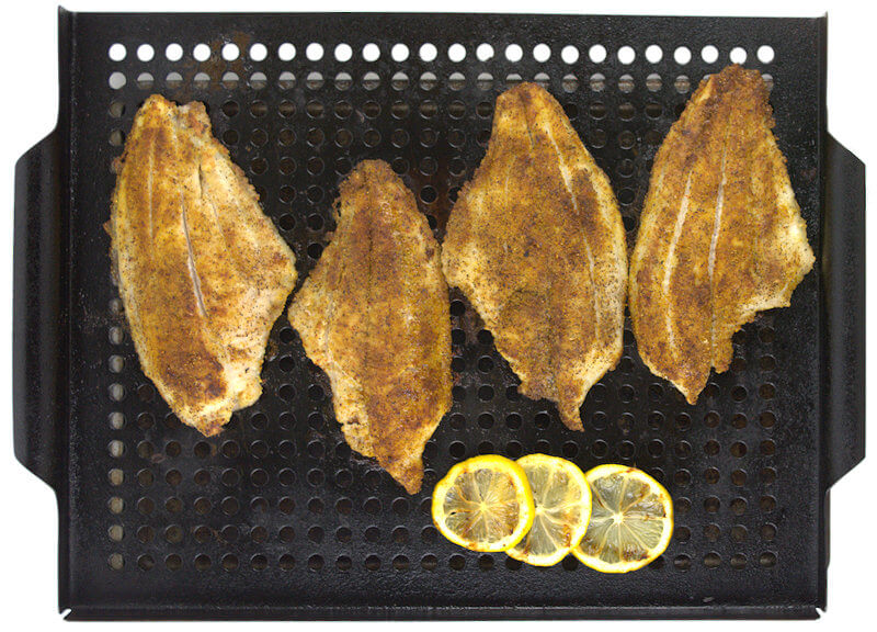Fish fillets with fish rub on grill dish