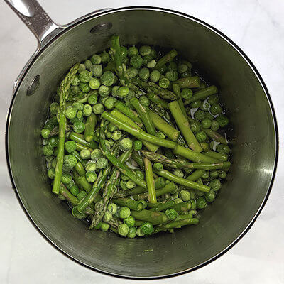 Step 1 - Wash the asparagus and cut them in 1-2 inch long pieces. Cook them, together with the peas in slightly salted water for about 2-3 minutes. Drain and cool in ice bath, to stop the cooking process.