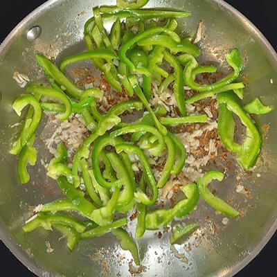 Step 4 - Add some oil, if needed, and transfer shallots, bell pepper, and freshly grated ginger into the same skillet and cook a few minutes, until it starts to brown. You most likely have brown bit in the bottom from the turkey; this will be dissolved in the next step.