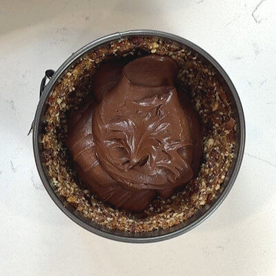 Step 5 - Continue the whisking until you have a mousse - a pure chocolate mousse. Pour the mousse in pecan-date crust, level the top and allow the pie to cool completely.